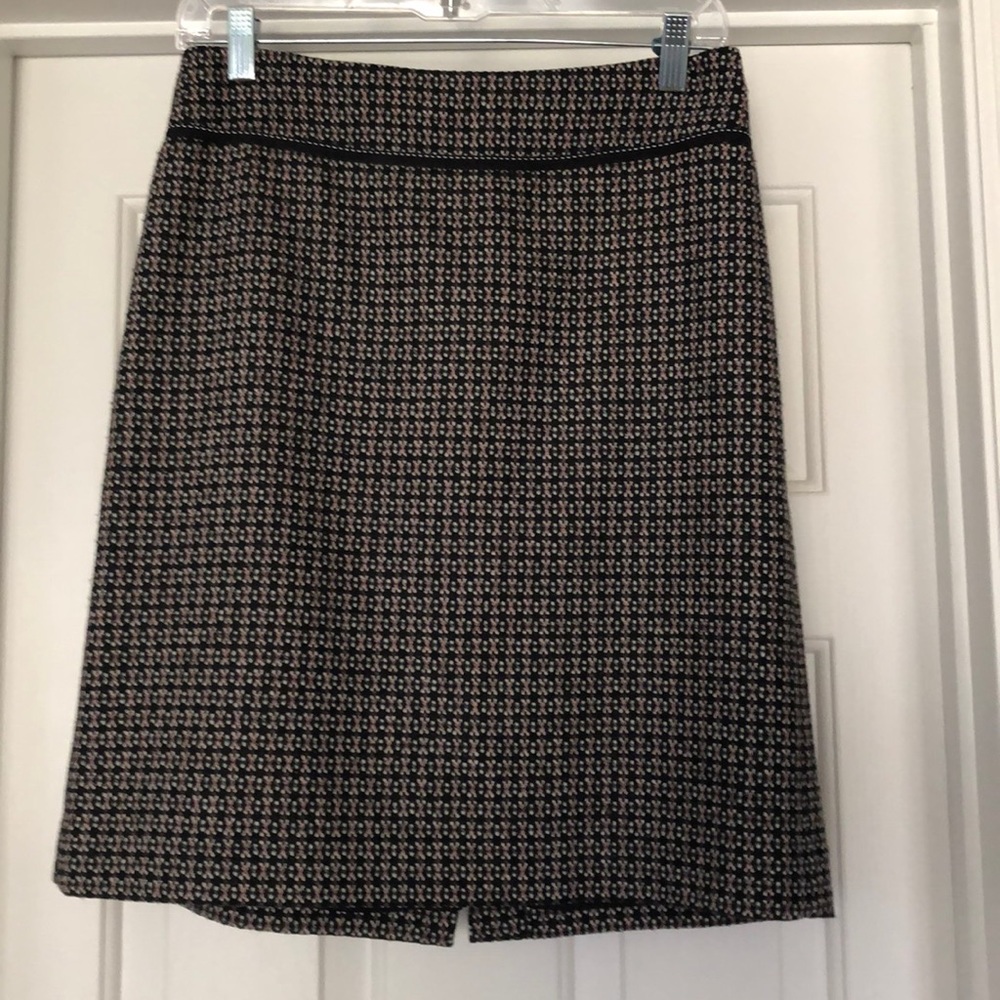 Black patterned wool skirt.